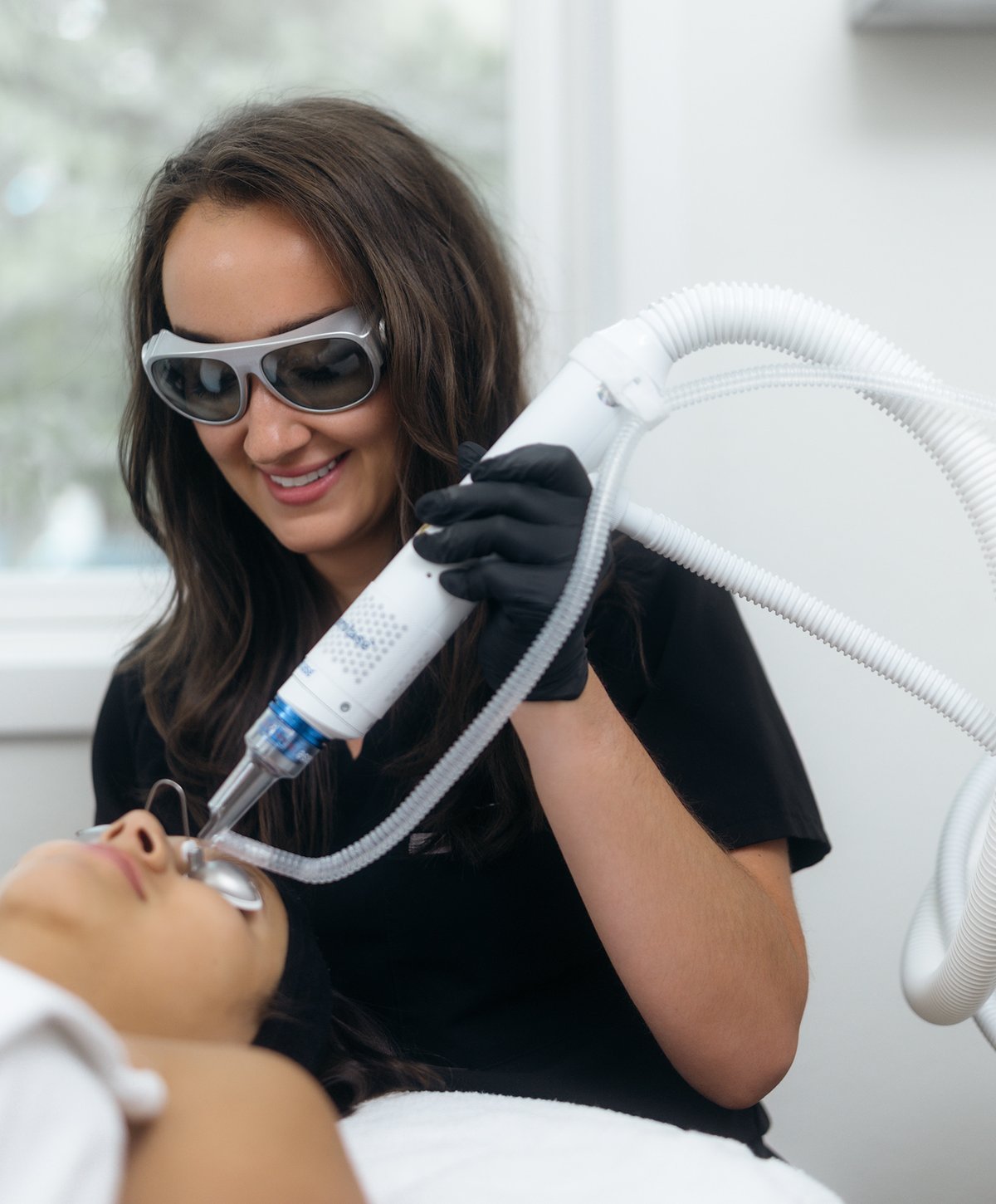 Boulder Skin Bar provider performing an Aerolase laser treatment