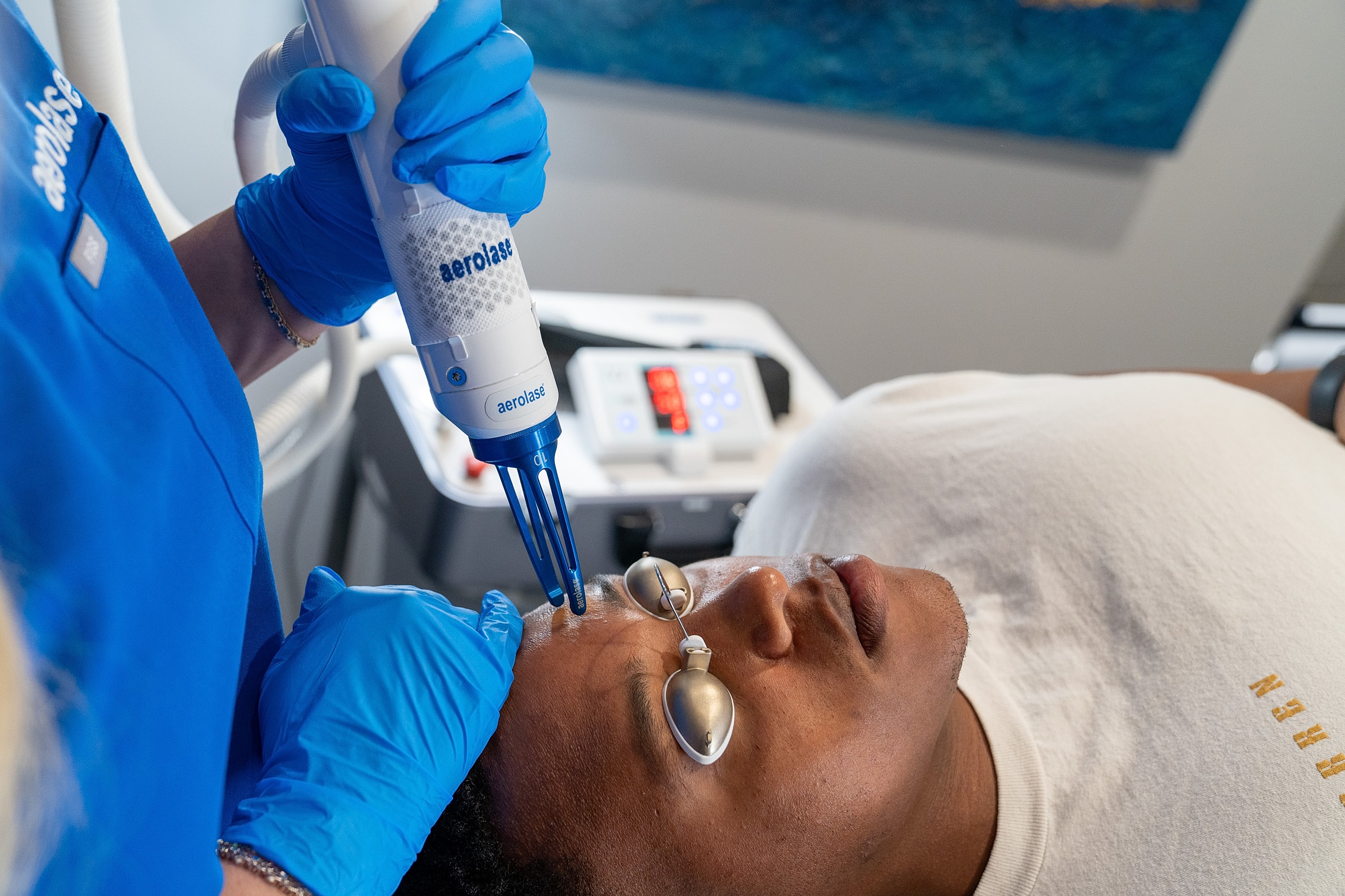 Laser skin treatment session in progress.